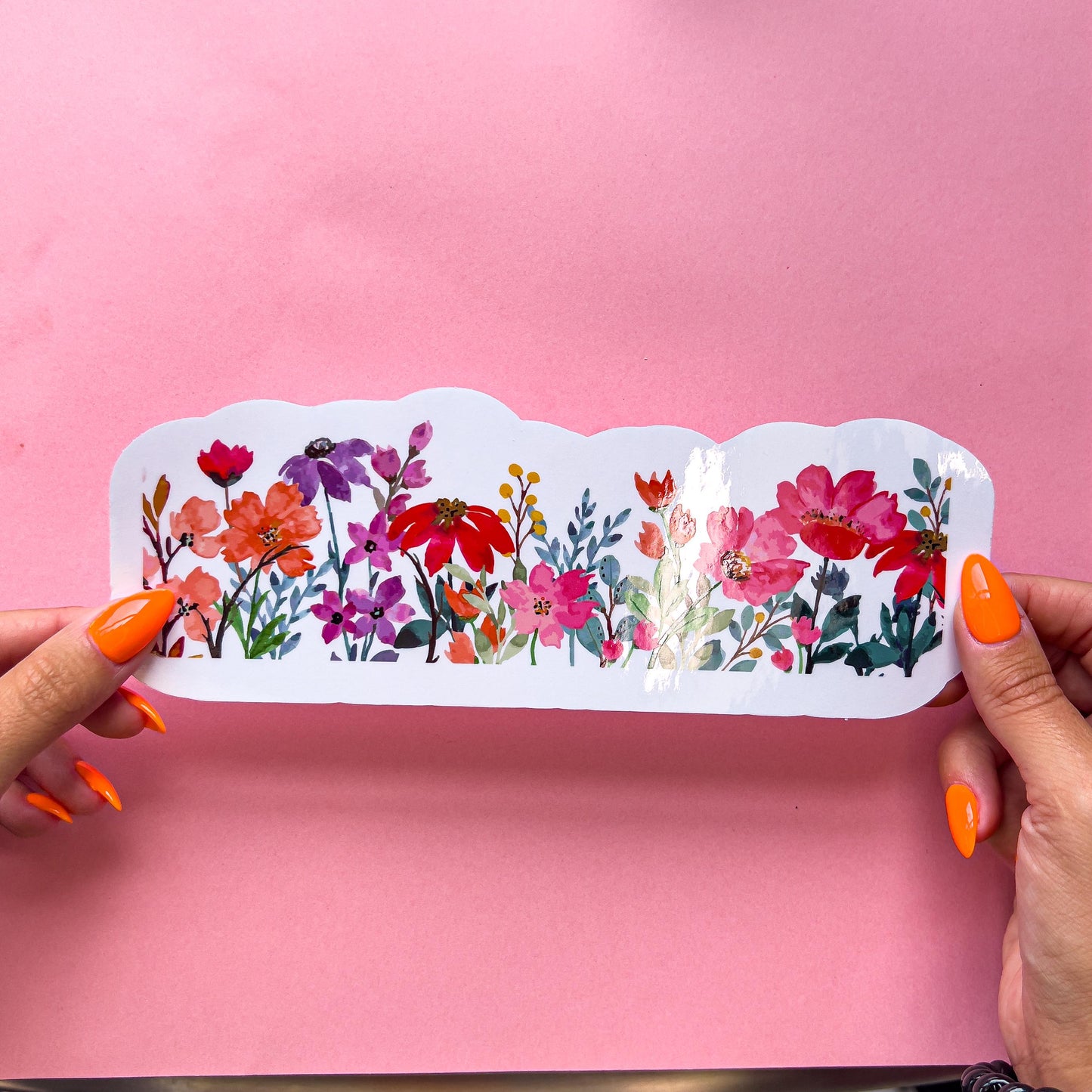 A vinyl decal sticker colorful and vibrant wildflower border on clear vinyl. Includes purple, orange, yellow, pink, red, and green colors.