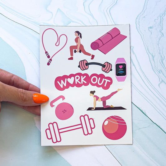 A gym/exercise themes sticker sheet featuring multiple pink and white equipment. The stickers include dumbbells, kettlebells, ball, smartwatch, yoga mat, jump rope, and the word "WORKOUT" in white text surrounded by pink. The "O" in "WORKOUT" is a heart.