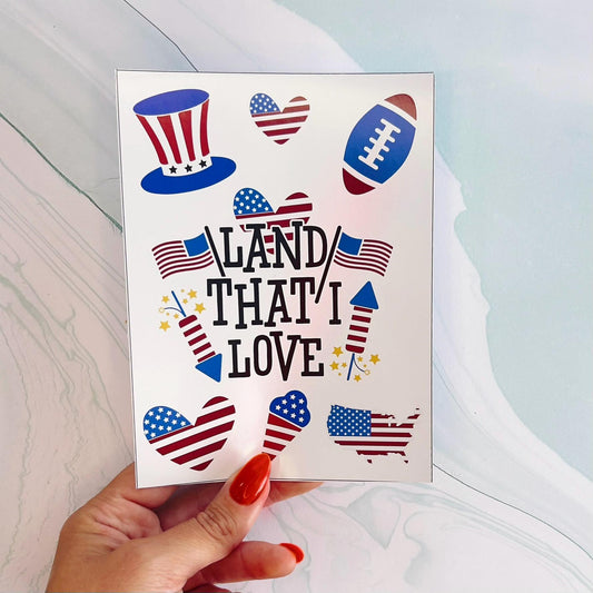 A sheet of various patriotic themed stickers. The stickers includes an ice cream cone, an American flag, a heart, a football, a firework, a hat, and the text 'LAND THAT I LOVE'.