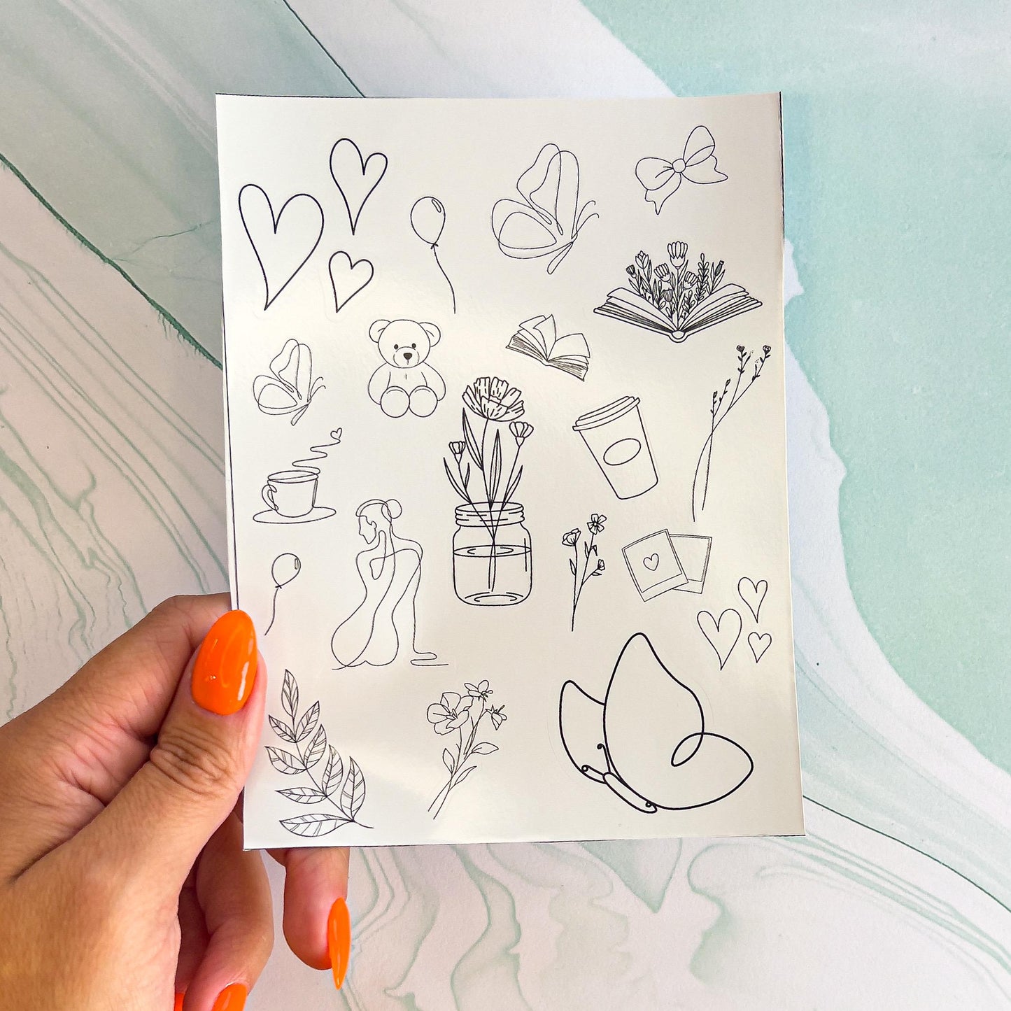 A sheet of minimalist, line drawing style stickers. The stickers include butterflies, hears, polaroids, a teddy bear, balloon, leaves, a book with flowers, a flower in a jar, a bow, flowers, and a line drawn women's willouette, ect.