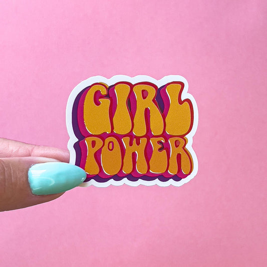 A vinyl decal sticker with the words 'Girl Power' in a retro, multi-colored font. The words are in a layered, 3D style with orange, pink, and purple colors.