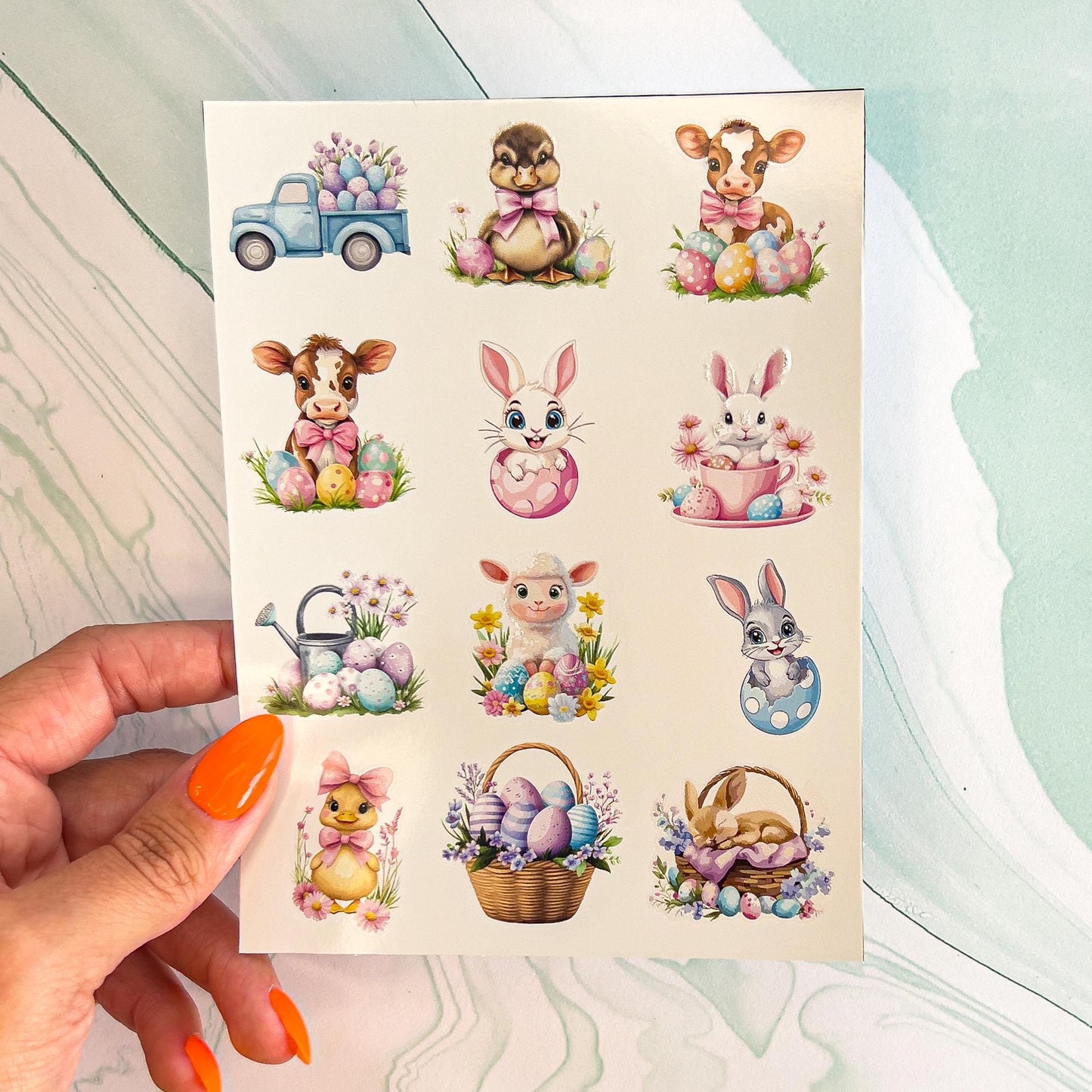 A sheet of various Easter stickers in pastel colors. The stickers include ducks, chicks, bunnies, cows, sheep, a truck, Easter eggs, and Easter baskets.