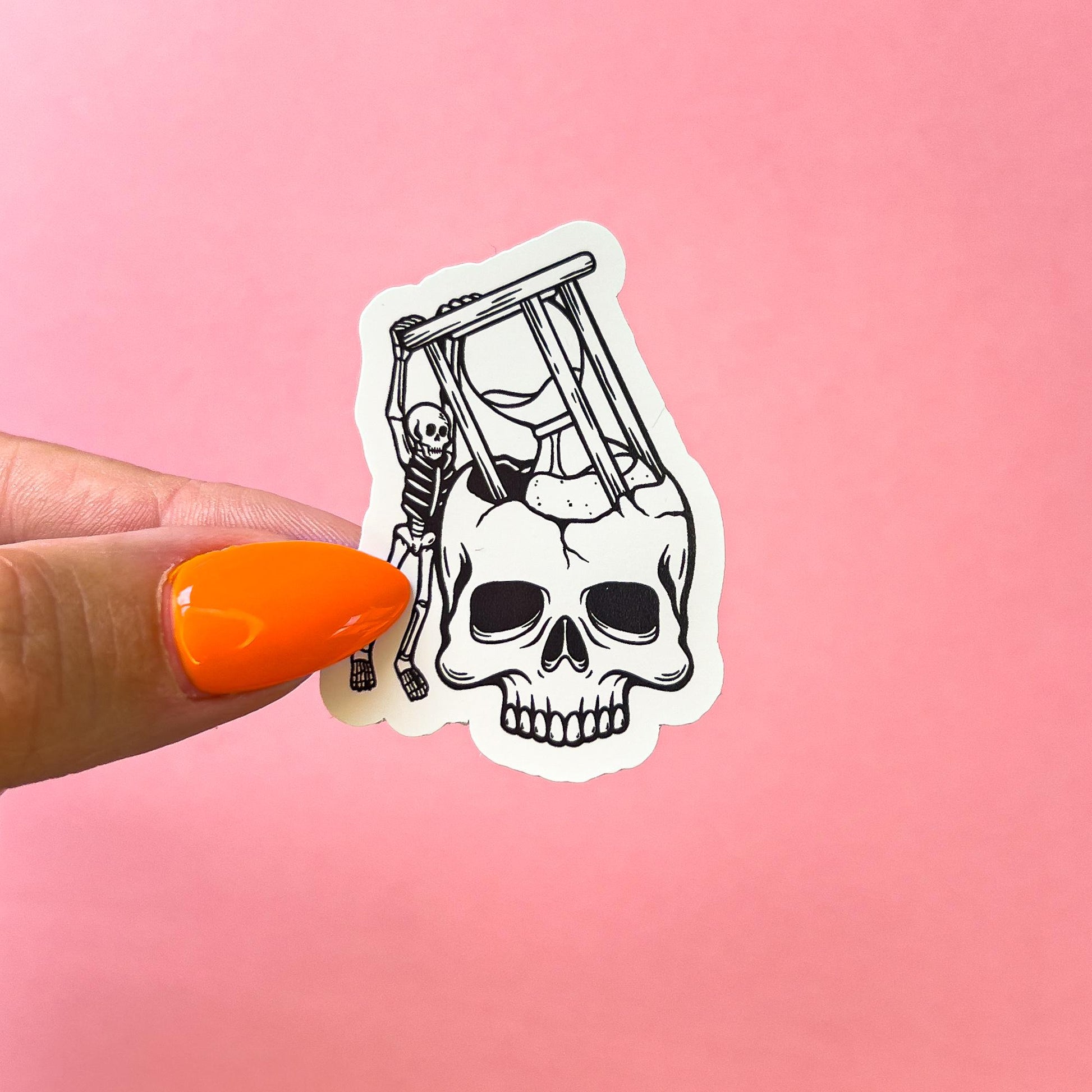 A vinyl decal sticker of a skull with an hourglass inside. A skeleton is holding the hourglass up. The hourglass is about to fall into the skull.