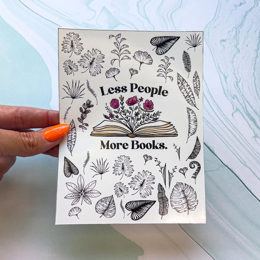 A sheet of stickers. The stickers include an open book with flowers growing from the pages and the words "Less People More Book" around the book and various black and white leaves.