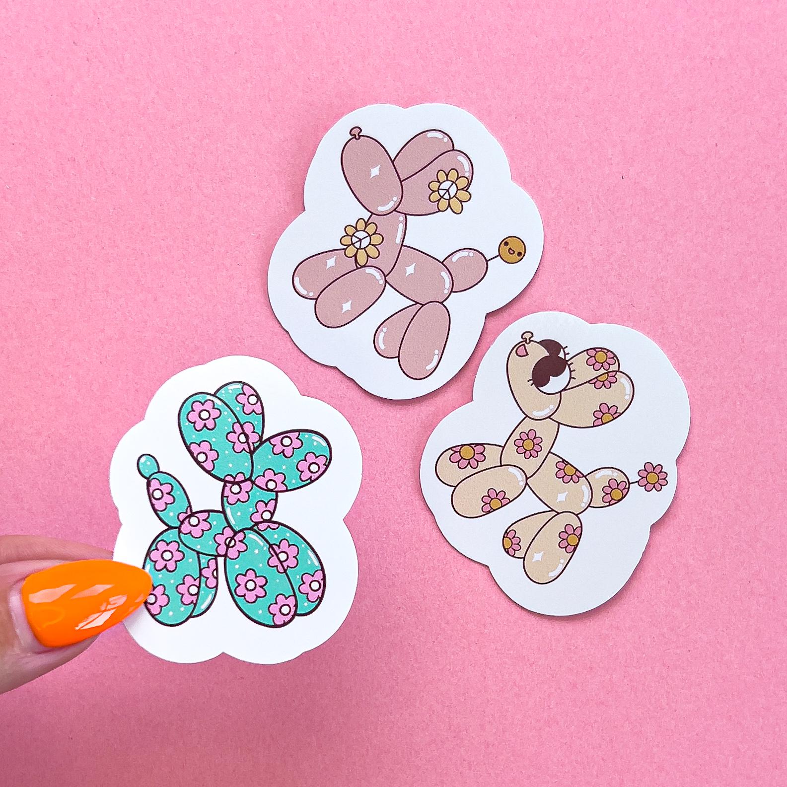 Vinyl decal stickers of balloon dogs in various colors and patterns.