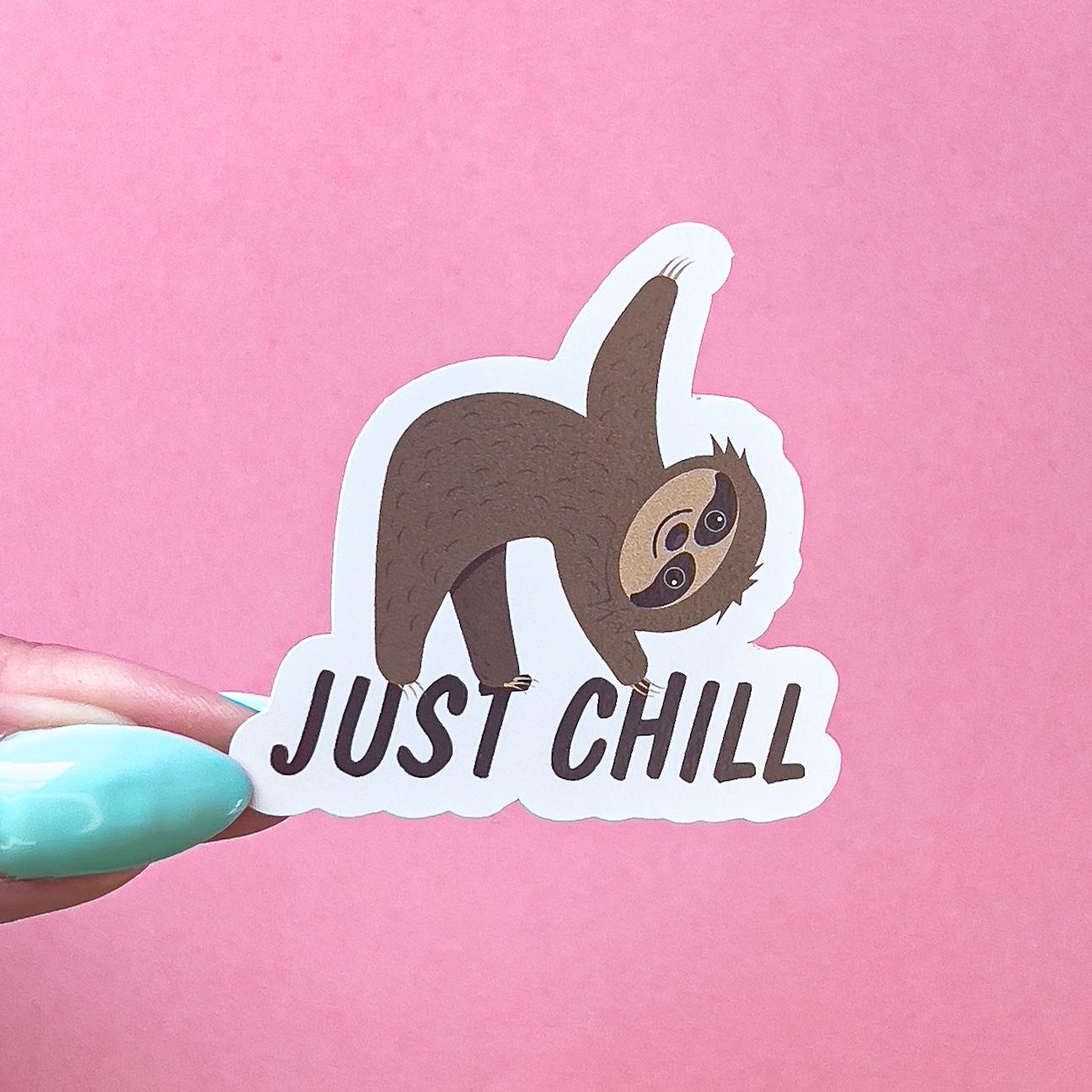 A vinyl decal sticker of a brown and beige sloth doing the Triangle/Trikonasana yoga pose. underneath black text reads “just chill”.