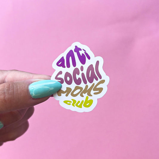 A vinyl decal sticker with the words 'anti social moms club' in a purple, pink, brown, and yellow gradient font.