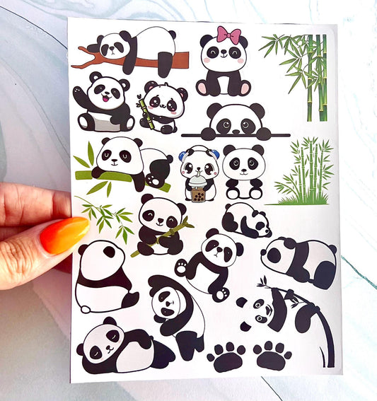 A sheet of cartoon panda stickers with various poses and expressions. The stickers are black and white and feature pandas holding bamboo, sleeping, and wearing a bow.