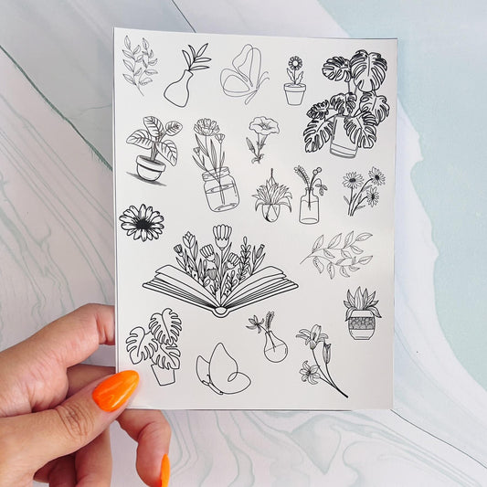 A sheet of various minimalist stickers. All stickers are black line drawings. The stickers include flowers, books, butterflies, and plants in various pots.
