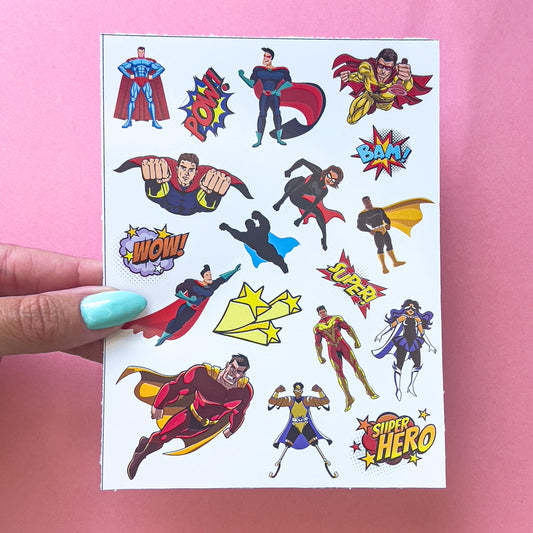 A sheet of stickers featuring various superhero characters in colorful costumes. The stickers have phrases like 'POW!' 'BAM!' 'WOW!' 'SUPER!' and 'SUPER HERO' in comic word bubbles.