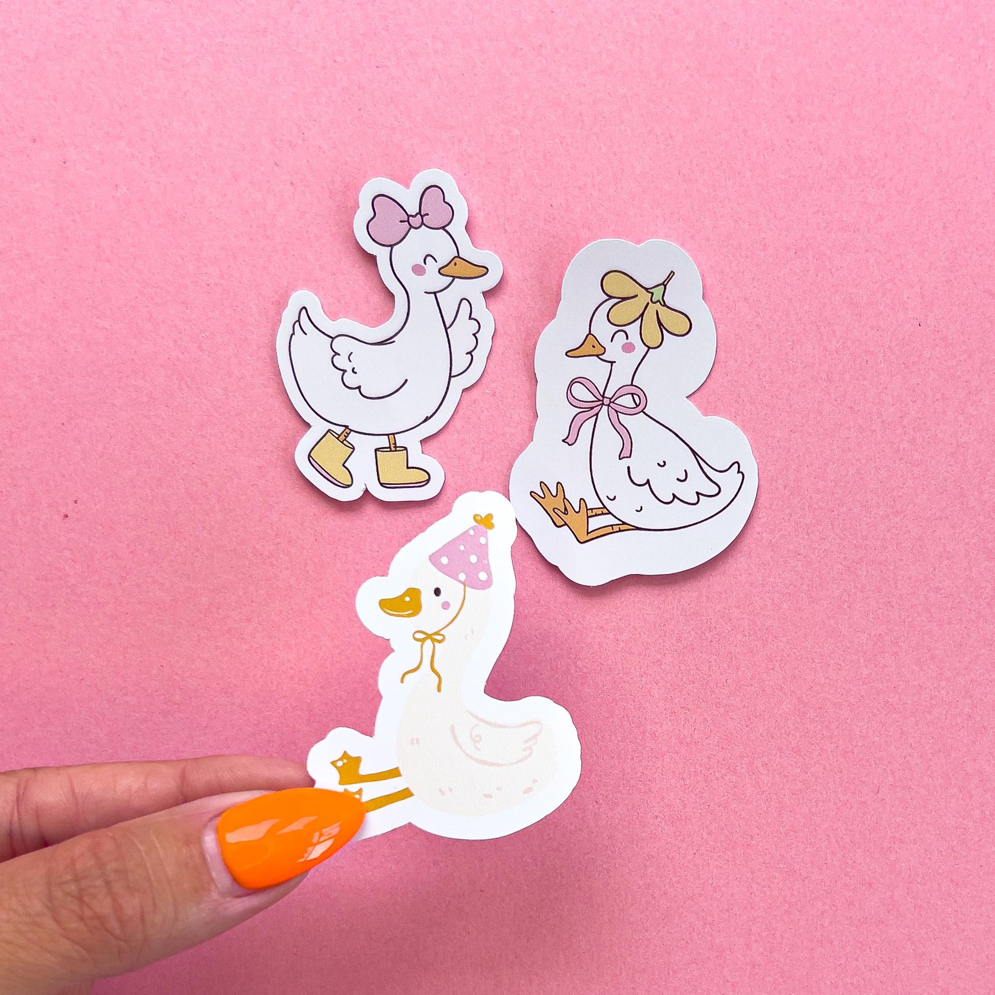 Three vinyl decal sticker options of white ducks or geese.