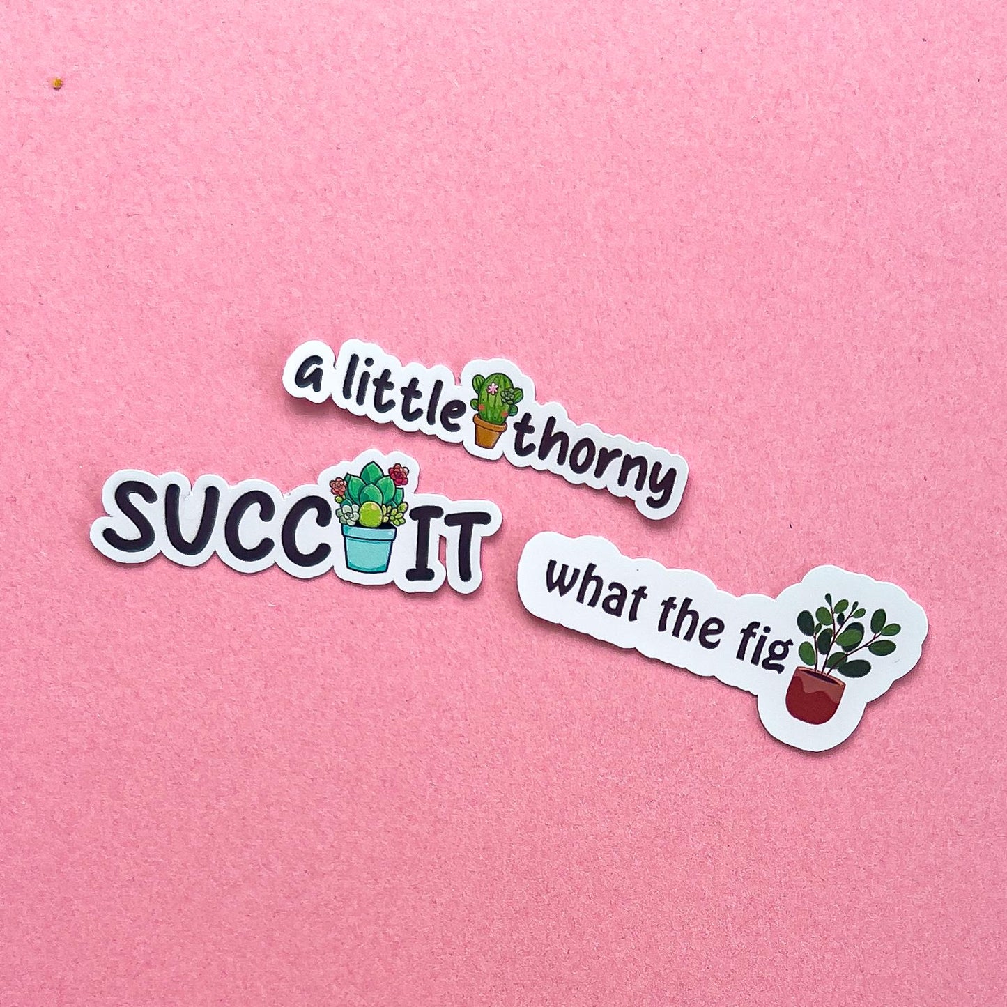 Three vinyl decal stickers of plant puns with plants.