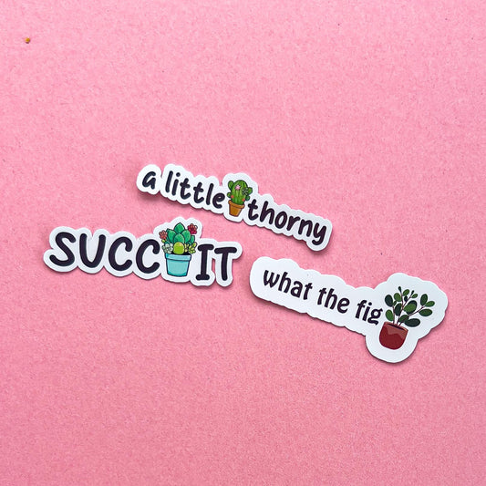 Three vinyl decal stickers of plant puns with plants.