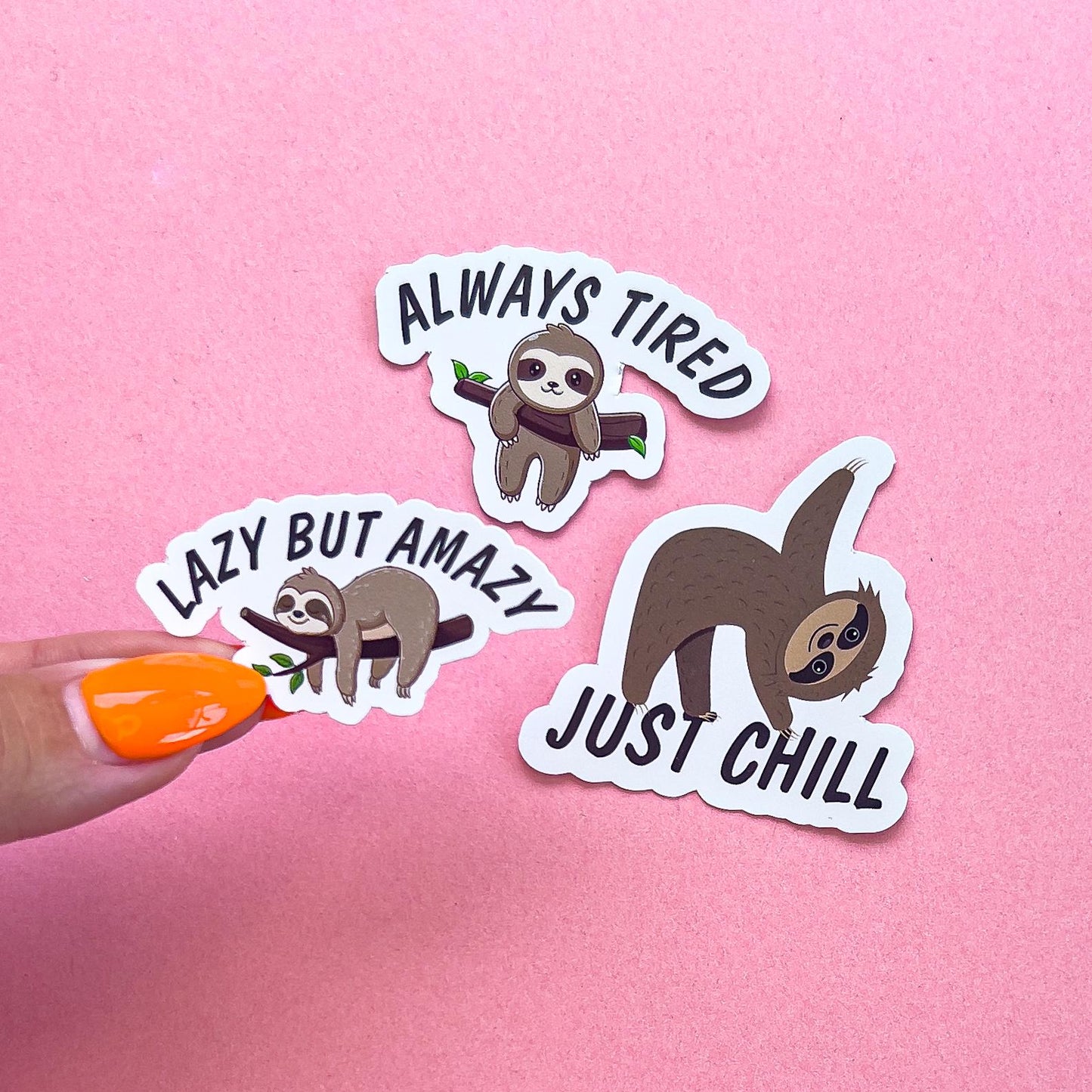 3 vinyl decal stickers of sloths in various poses with various sayings.