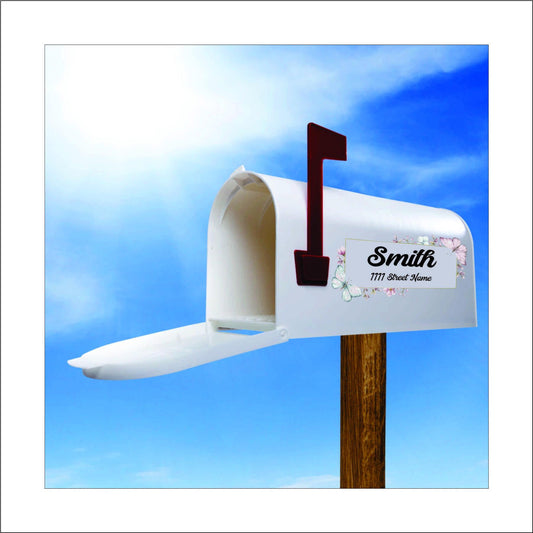 A custom vinyl decal sticker for mailbox with a colorful floral design in the corners and the name 'Smith' and street address printed on it, this would be replaced with your name and address.