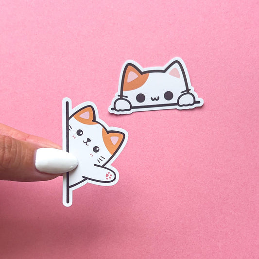 Vinyl decal stickers of orange and white cats.