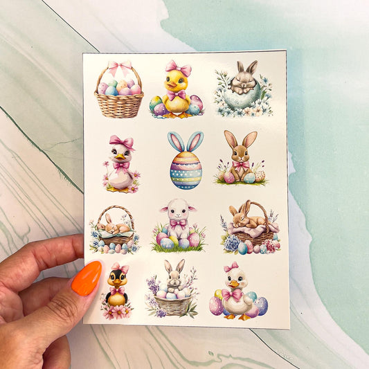 A sheet of various Easter stickers in pastel colors. The stickers include ducks, chicks, bunnies, Easter eggs, and Easter baskets.